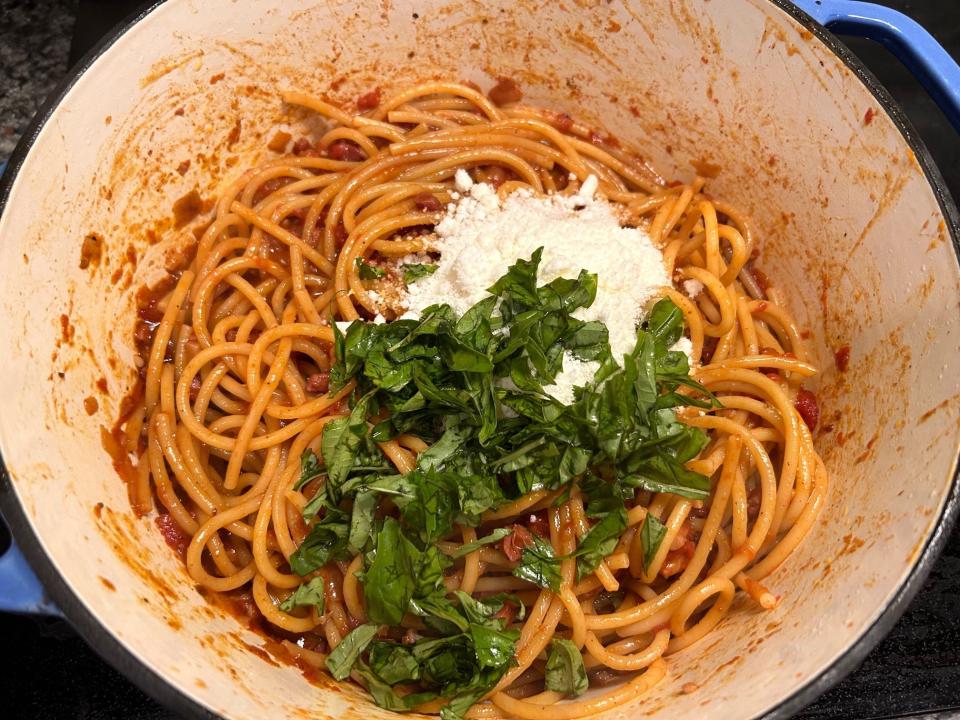 Adding the cheese and basil to Ina Garten's weeknight pasta