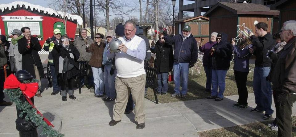 People gathered on the northeast quadrant of Public Square at noon on New Year’s Day 2015 with bells of all sizes and sounds. Then Belleville Mayor Mark Eckert, center. lead them in two minutes of bell-ringing.