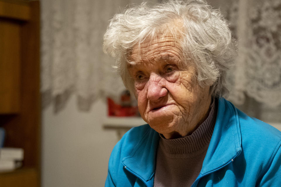 In this photo taken Friday, Jan. 24, 2020, Nazi camps survivor Marija Frlan, who will turn 100 on the Holocaust Remembrance day, talks to the Associated Press during an interview at her home in Rakek, Slovenia. Frlan, who was held at the Ravensbruck camp in northern Germany for over a year in 1944-45, will join other survivors and officials in Poland on Monday for the ceremonies marking the 75th anniversary of the liberation of the Auschwitz camp. (AP Photo/Darko Bandic)