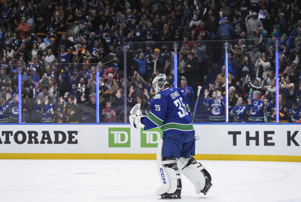 Vancouver Canucks goalie Thatcher Demko celebrates after the team's win over the Calgary Flames in an NHL hockey game Tuesday, April 16, 2024, in Vancouver, British Columbia. (Darryl Dyck/The Canadian Press via AP)