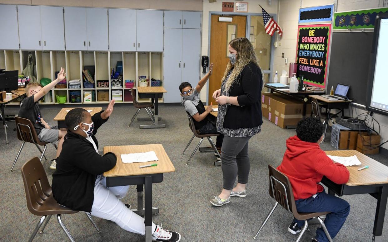 <span class="caption">Learning support teachers such as Sabrina Werley are common, but schools' services can vary widely.</span> <span class="attribution"><a class="link " href="https://www.gettyimages.com/detail/news-photo/sabrina-werley-works-with-her-4th-grade-students-in-a-math-news-photo/1312861050" rel="nofollow noopener" target="_blank" data-ylk="slk:Ben Hasty/MediaNews Group/Reading Eagle via Getty Images;elm:context_link;itc:0;sec:content-canvas">Ben Hasty/MediaNews Group/Reading Eagle via Getty Images</a></span>