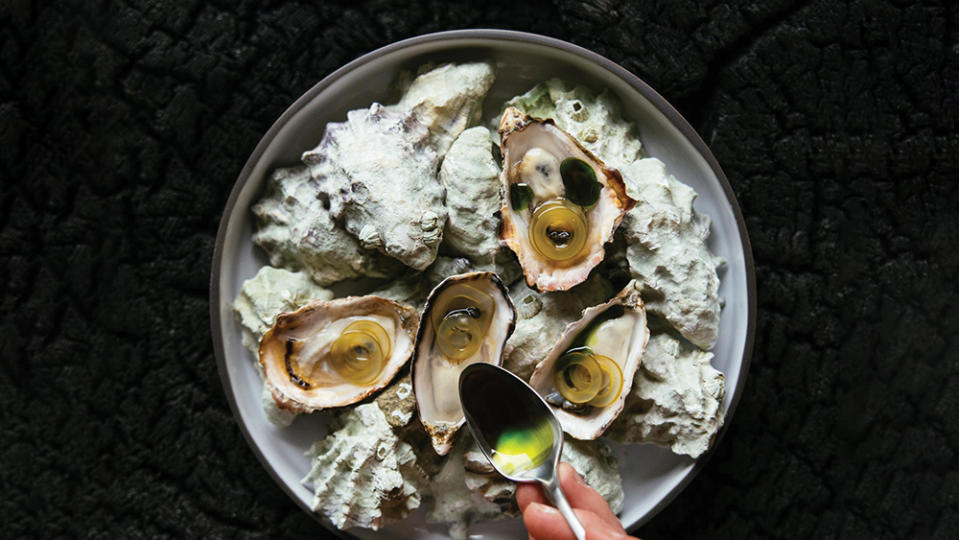 Kusshi oysters are finished with pickled kelp and pine oil. - Credit: Jeremy Kopeks