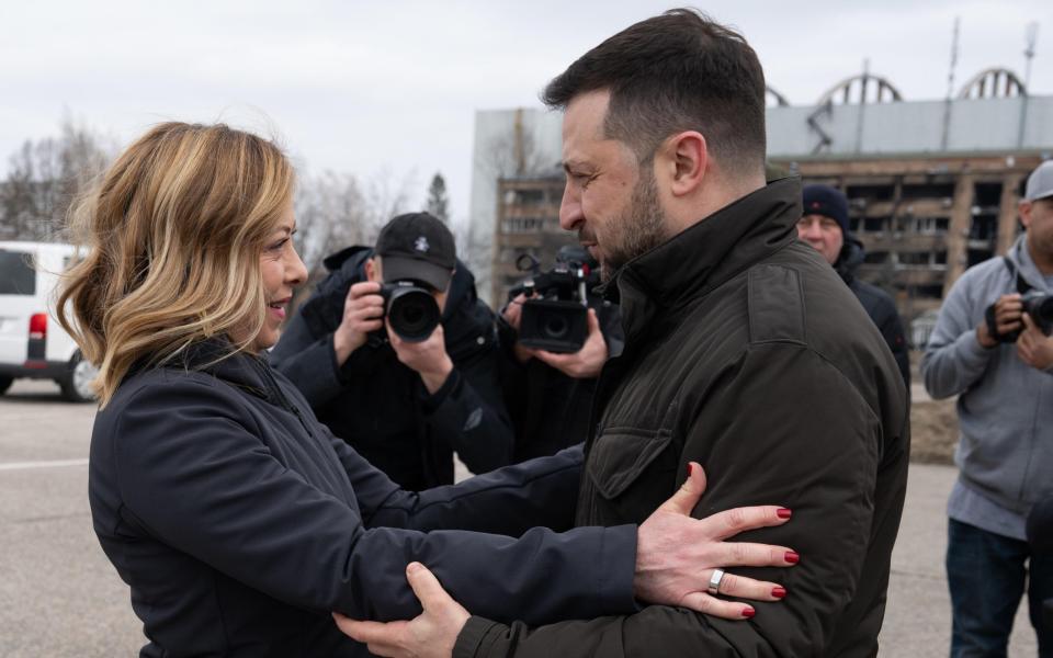 Italian Prime Minister Giorgia Meloni (L) meeting with Ukrainian President Volodymyr Zelensky on the second anniversary of the Russian invasion