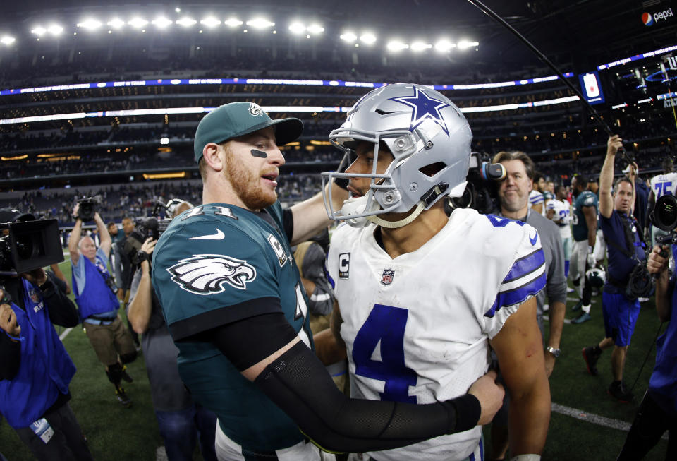 Eagles quarterback Carson Wentz, left, and Cowboys quarterback Dak Prescott have been relatively evenly matched to this point in their careers. (AP Photo/Ron Jenkins, File)