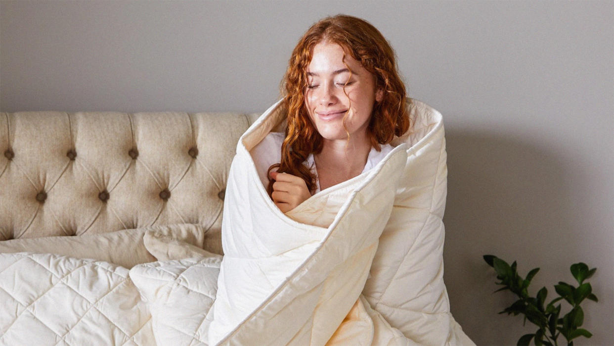  A person wrapped up in the Woolroom Deluxe Washable Wool Duvet. 