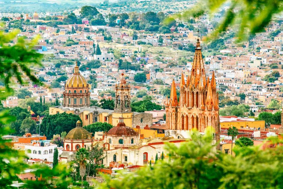 A church in San Miguel de Allende, seen through greenery