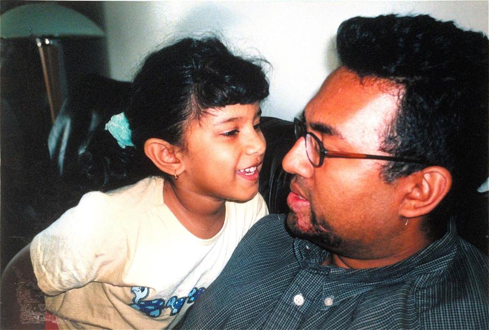 The day Silvion Ramsundar was released from the hospital in 2001. Here he is with their daughter, Mariah