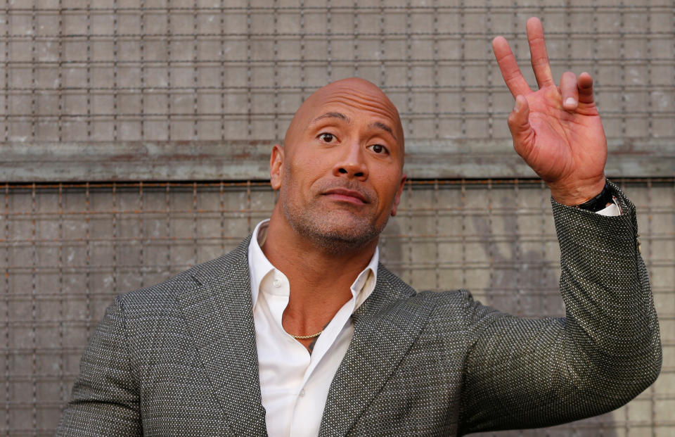 Cast member Dwayne Johnson poses at the premiere for the movie “Rampage” in Los Angeles, California, U.S., April 4, 2018. REUTERS/Mario Anzuoni