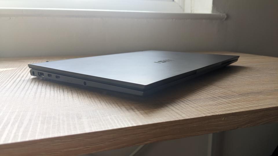 The MSI Prestige 13 Evo ultrabook pictured on a wooden desk.