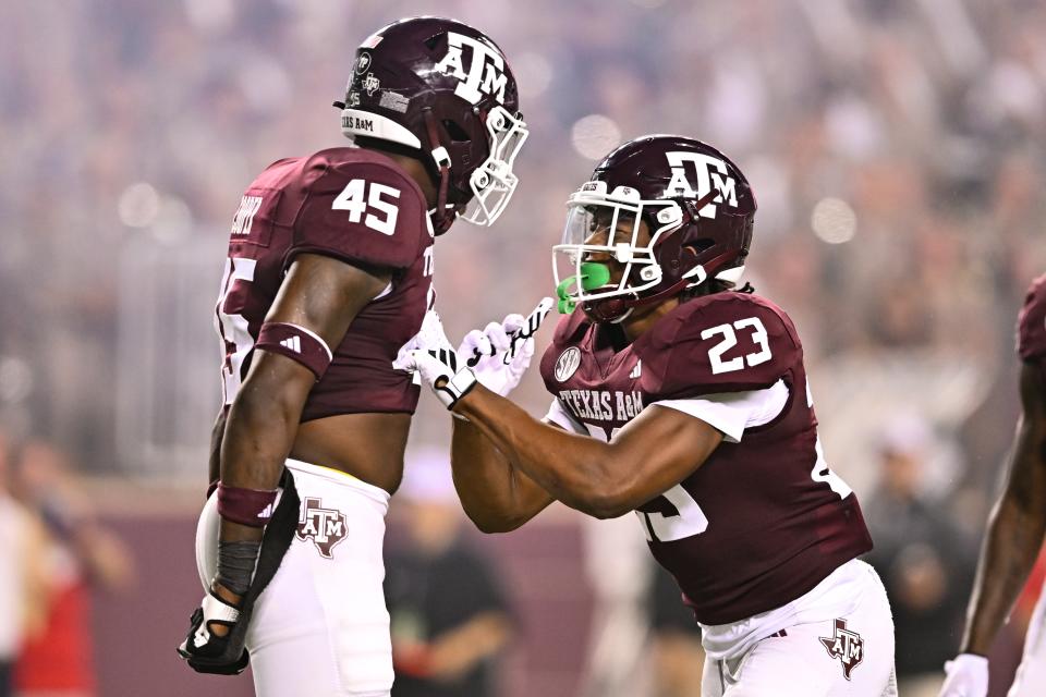 Sep 2, 2023; College Station, Texas; Texas A&M Aggies linebacker Chantz Johnson (23) and linebacker Edgerrin Cooper (45) react to a play during the third quarter against New Mexico Lobos at Kyle Field. Maria Lysaker-USA TODAY Sports