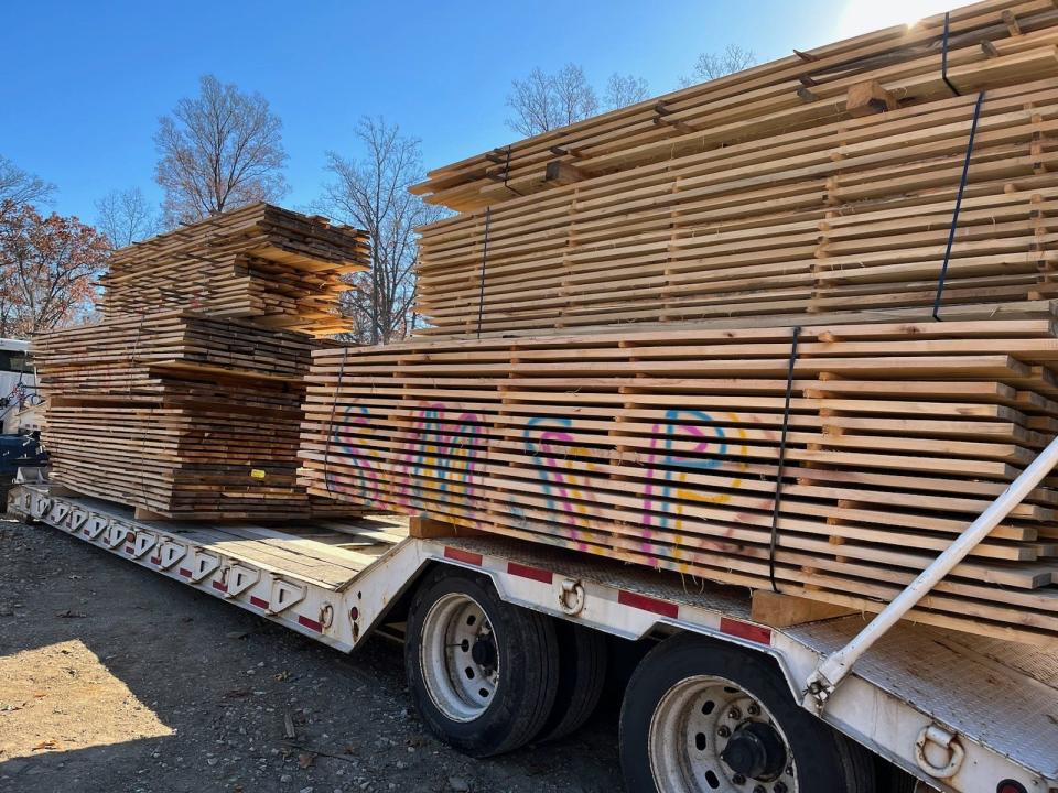 Boards from popular trees downed during a March 31, 2023, tornado that went through parts of McCormick's Creek State Park are transported for curing before they can be used as part of renovations of the Pioneer Village grist mill at Spring Mill State Park near Mitchell.