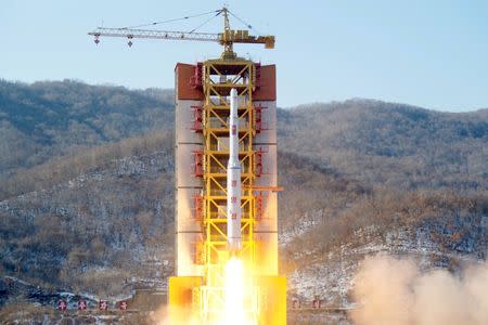 FILE PHOTO: A North Korean long-range rocket is launched into the air at the Sohae rocket launch site, North Korea, in this photo released by Kyodo February 7, 2016. Mandatory credit REUTERS/Kyodo/File Photo