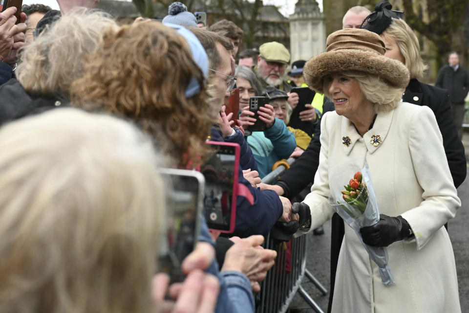 Britain's Queen Camilla meets well-wishers after attending the Royal Maundy Service, in Worcester, England, Thursday, March 28, 2024. Maundy Thursday is the Christian holy day falling on the Thursday before Easter. The monarch commemorates Maundy by offering 'alms' to senior citizens. Each recipient receives two purses, one red and one white. (Justin Tallis, Pool Photo via AP)