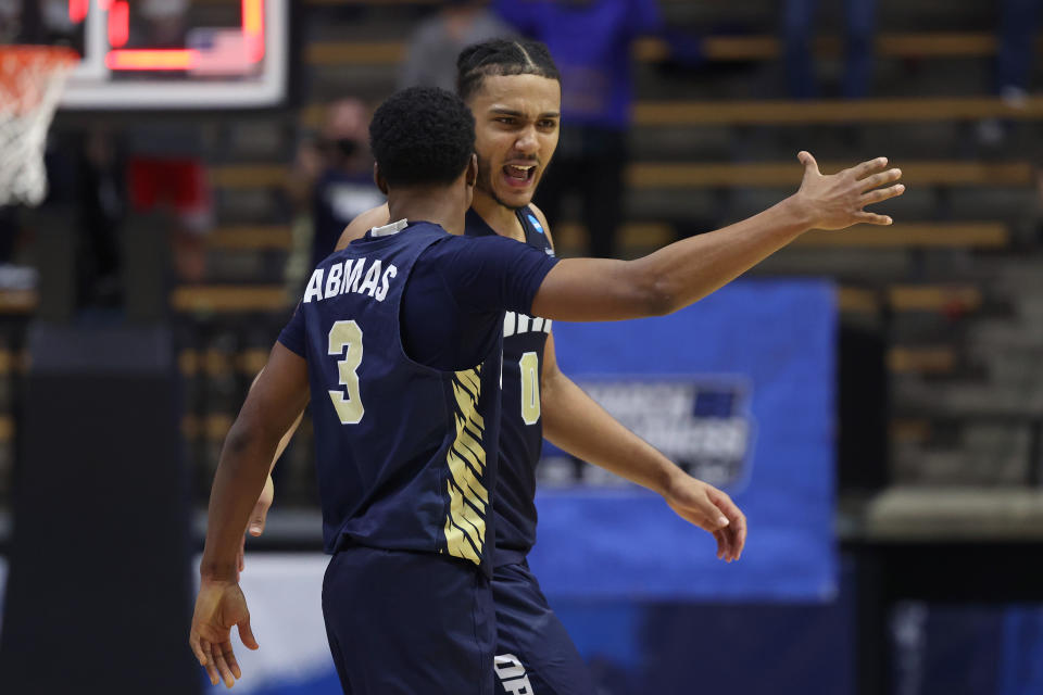 Kevin Obanor #0 and Max Abmas #3 of Oral Roberts react after defeating Ohio State in the NCAA men's tournament on March 19. (Gregory Shamus/Getty Images)