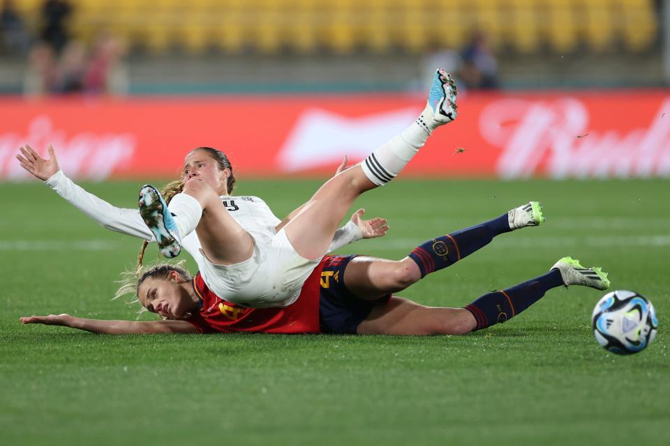 July 21: Costa Rica's Maria Paula Sala, top, and Spain's Irene Paredes collide during the World Cup in Wellington, New Zealand.