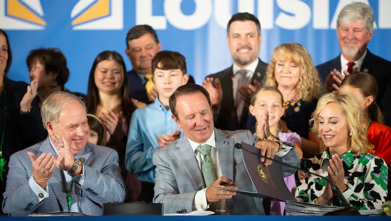 Louisiana Gov. Jeff Landry signs bills related to his education plan on Wednesday, June 19, 2024, at Our Lady of Fatima Catholic School in Lafayette, La. Louisiana has become the first state to require that the Ten Commandments be displayed in every public school classroom, the latest move from a GOP-dominated Legislature pushing a conservative agenda under a new governor.