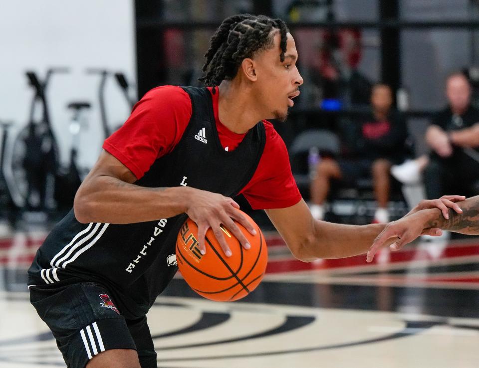 Khani Rooths dribbles upcourt during practice before the Cards headed to the Bahamas.