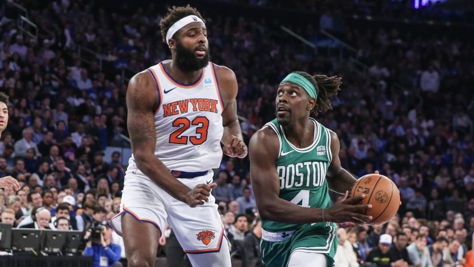 Boston Celtics guard Jrue Holiday (4) looks to drive past New York Knicks center Mitchell Robinson (23) in the second quarter at Madison Square Garden.