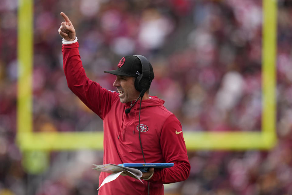 San Francisco 49ers head coach Kyle Shanahan signals from the sideline during the second half of an NFL football game against the Washington Commanders, Sunday, Dec. 31, 2023, in Landover, Md. (AP Photo/Alex Brandon)