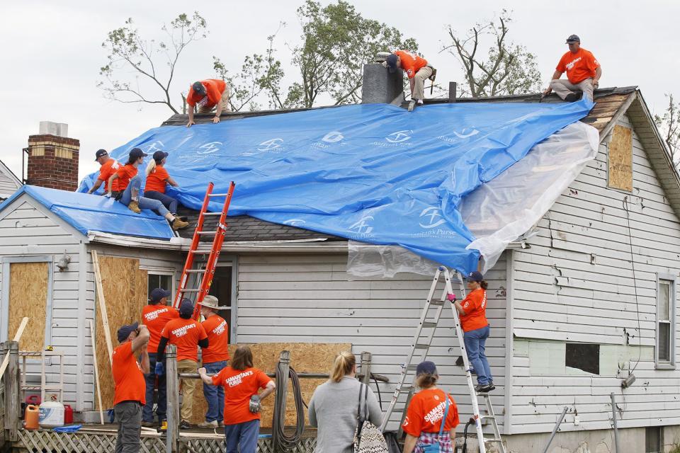 Volunteers with Samaritan's Purse worked in this Harrison Twp. neighborhood and others that were affected by tornado damage. The workers covered this house on Maumee Avenue.  WHIO File
