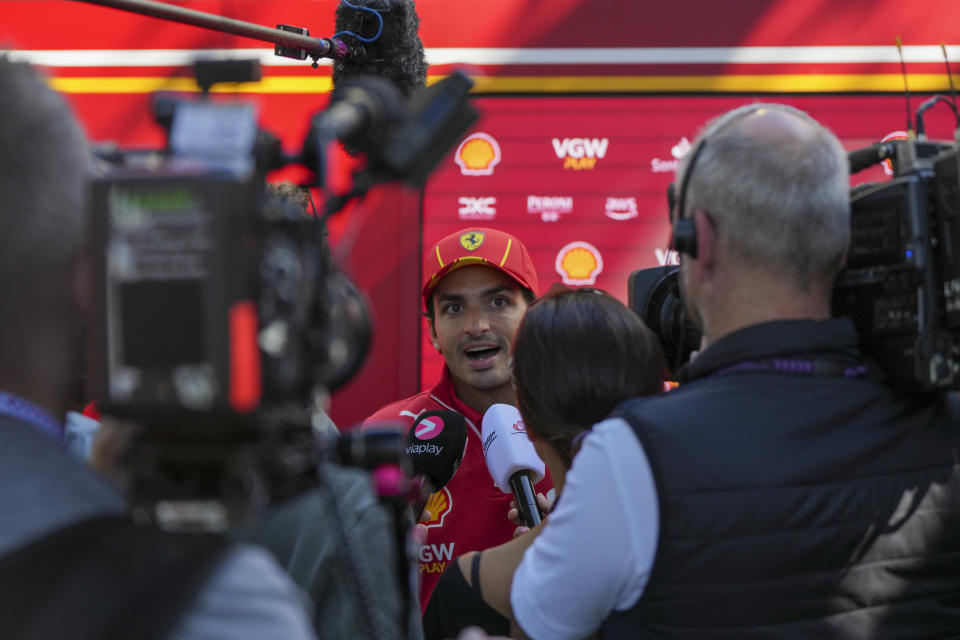 Ferrari driver Carlos Sainz of Spain reacts as he is interviewed ahead of the Australian Formula One Grand Prix at Albert Park, Melbourne, Australia, Thursday, March 21, 2024. (AP Photo/Asanka Brendon Ratnayake)