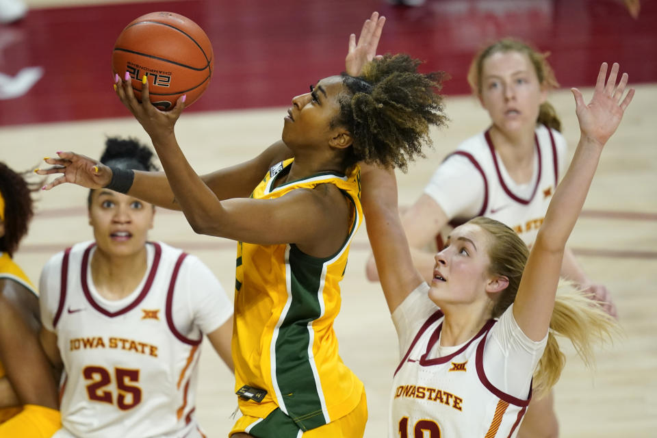 Baylor guard DiDi Richards drives to the basket past Iowa State guard Kylie Feuerbach, right, during the second half of an NCAA college basketball game, Sunday, Jan. 31, 2021, in Ames, Iowa. Baylor won 85-77. (AP Photo/Charlie Neibergall)