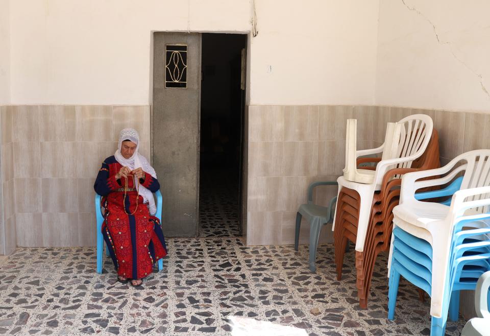 Muftiya Tlaib, Rep. Rashida Tlaib's grandmother, sits on the front porch of her home in Beit Ur Al-Fauqa, a village in the West Bank, on Sept. 10, 2019.