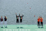 <p>Gold medalists Valentina Rodini and Federica Cesarini of Team Italy celebrate during the medal ceremony for the Lightweight Women's Double Sculls Final A on day six of the Tokyo 2020 Olympic Games at Sea Forest Waterway on July 29, 2021 in Tokyo, Japan. (Photo by Adam Pretty/Getty Images)</p> 