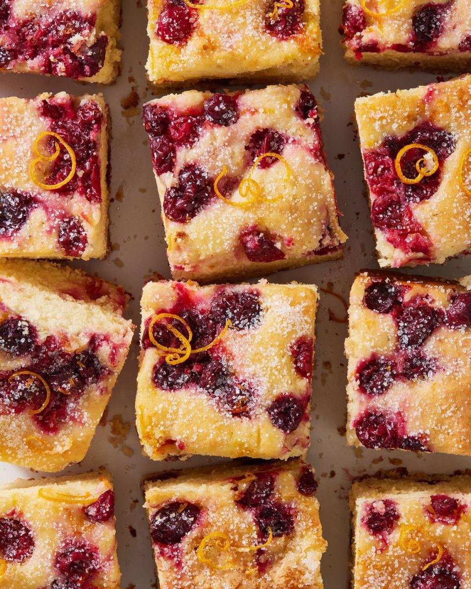 cranberry mimosa breakfast cake with orange zest and sugar