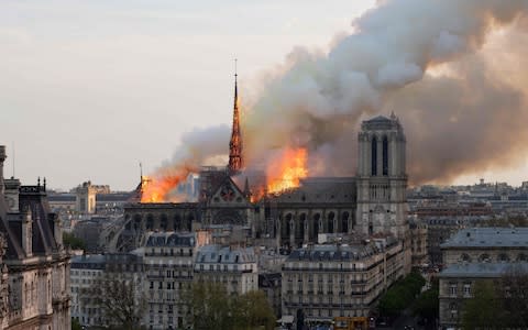 Bells will toll at English churches tonight to mark the moment the fire started at Notre-Dame yesterday - Credit: FABIEN BARRAU/AFP