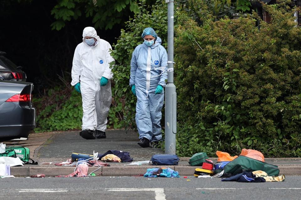 Forensics examine the scene (AFP via Getty Images)