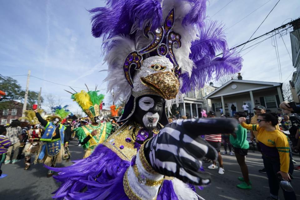 A member of the traditional Mardi Gras group The Trams marches during the Krewe of Zulu Parade on Mardi Gras Day in New Orleans, Tuesday, Feb. 21, 2023. (AP Photo/Gerald Herbert)