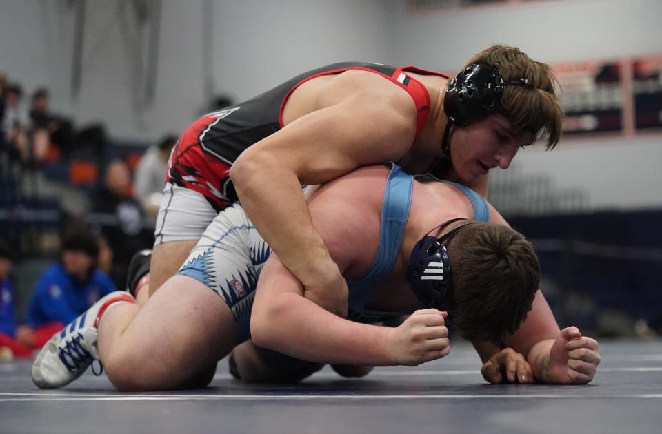 Fox Lane's Nathan Brauning  defeats John Jay-East Fishkill's Michael Mauro in the 215-pound championship match of the Div. 1 wrestling tournament at Horace Greeley High School in Chappaqua on Saturday, February 4, 2023. 