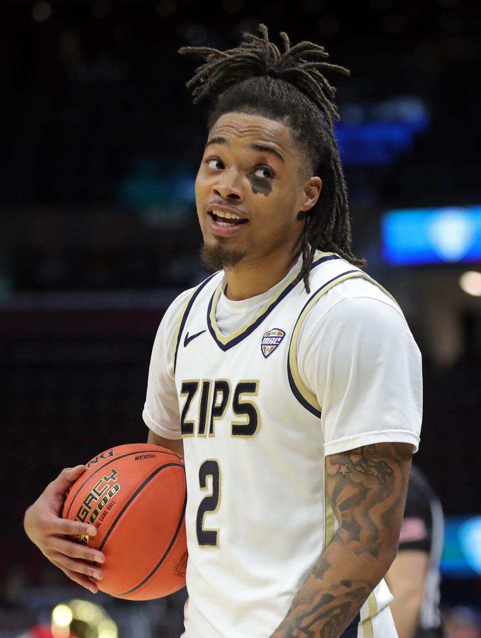 Akron Zips guard Greg Tribble (2) has a word with court side fans after a win against the Miami (OH) Redhawks in an NCAA college basketball game in the quarterfinals of the Mid-American Conference Tournament at Rocket Mortgage FieldHouse, Thursday, March 14, 2024, in Cleveland, Ohio.