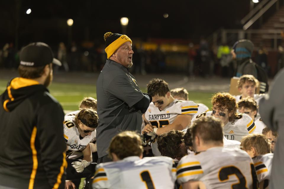 Garfield head coach Mike Moser addresses his team after they fall to the Perry Pirates in an OHSAA regional semifinal playoff game Friday, Nov. 10, 2023 in Maple Heights, OH.
