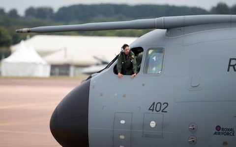 A crew member looks out the window of a RAF Airbus A400M as it arrives at RAF Fairford. July 7, 2016. - Credit: Matt Cardy/Getty Images Europe