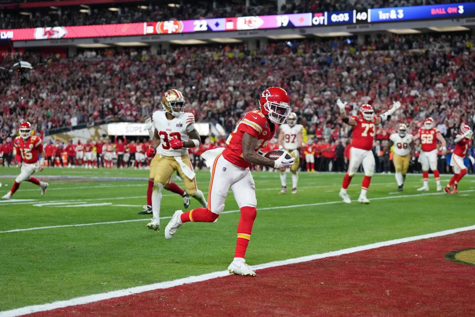 Feb 11, 2024; Paradise, Nevada, USA; Kansas City Chiefs wide receiver Mecole Hardman Jr. (12) scores a touchdown against the San Francisco 49ers in overtime during Super Bowl LVIII at Allegiant Stadium. Mandatory Credit: Kirby Lee-USA TODAY Sports