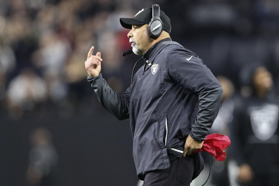 Las Vegas Raiders interim head coach Rich Bisaccia motions towards the field during the second half of an NFL football game against the Los Angeles Chargers, Sunday, Jan. 9, 2022, in Las Vegas. (AP Photo/Ellen Schmidt)