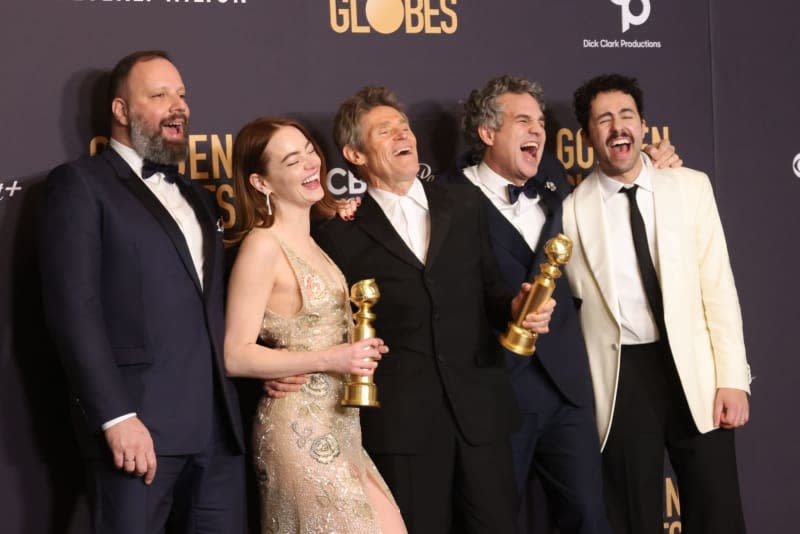 (L-R) Actors Yorgos Lanthimos, Emma Stone, Willem Dafoe, Mark Ruffalo, and Ramy Youssef, winners of the Best Picture, Musical or Comedy award for "Poor Things" pose in the press room during the 81st Annual Golden Globe Awards at The Beverly Hiltonز Crash/imageSPACE via ZUMA Press Wire/dpa