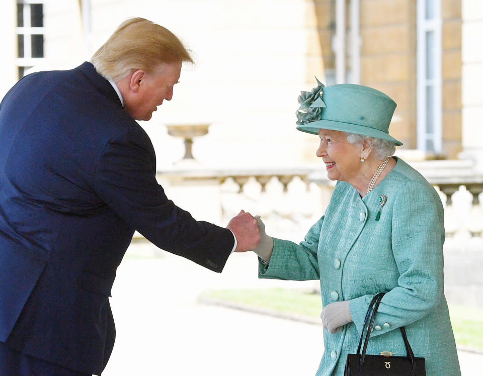 Alternate crop: Queen Elizabeth II greets US President Donald Trump as he arrives for the Ceremonial Welcome at Buckingham Palace, London, on day one of his three day state visit to the UK.