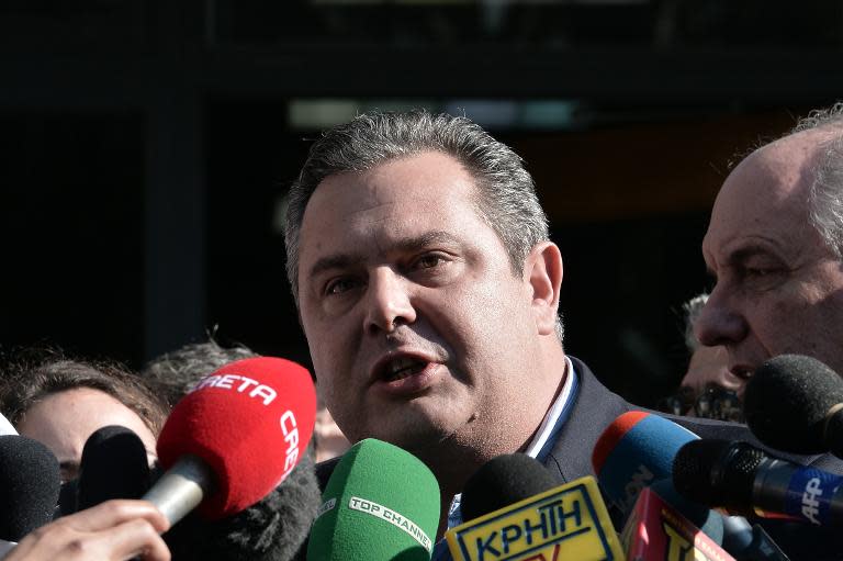 Independent Greeks leader Panos Kammenos talks to media after his meeting at Syriza's headquarters in Athens on January 26, 2015