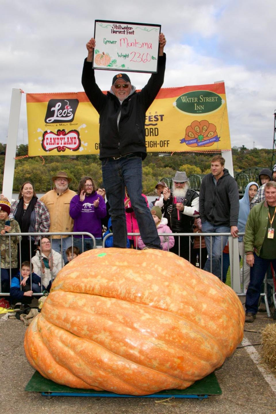 Tom Montsma of Brandon, Wisc., celebrates winning third place at the giant pumpkin weigh-off in Stillwater, Minn. at the Stillwater Harvest Festival on Oct. 14 and 15. Montsma's pumpkin topped the scale at 2,360 lbs.