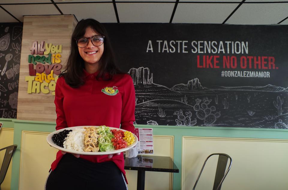 Maryanna Paiva, owner of González House in downtown Bridgewater, shows off one of the restaurant's dishes on Wednesday, Jan. 18, 2023.