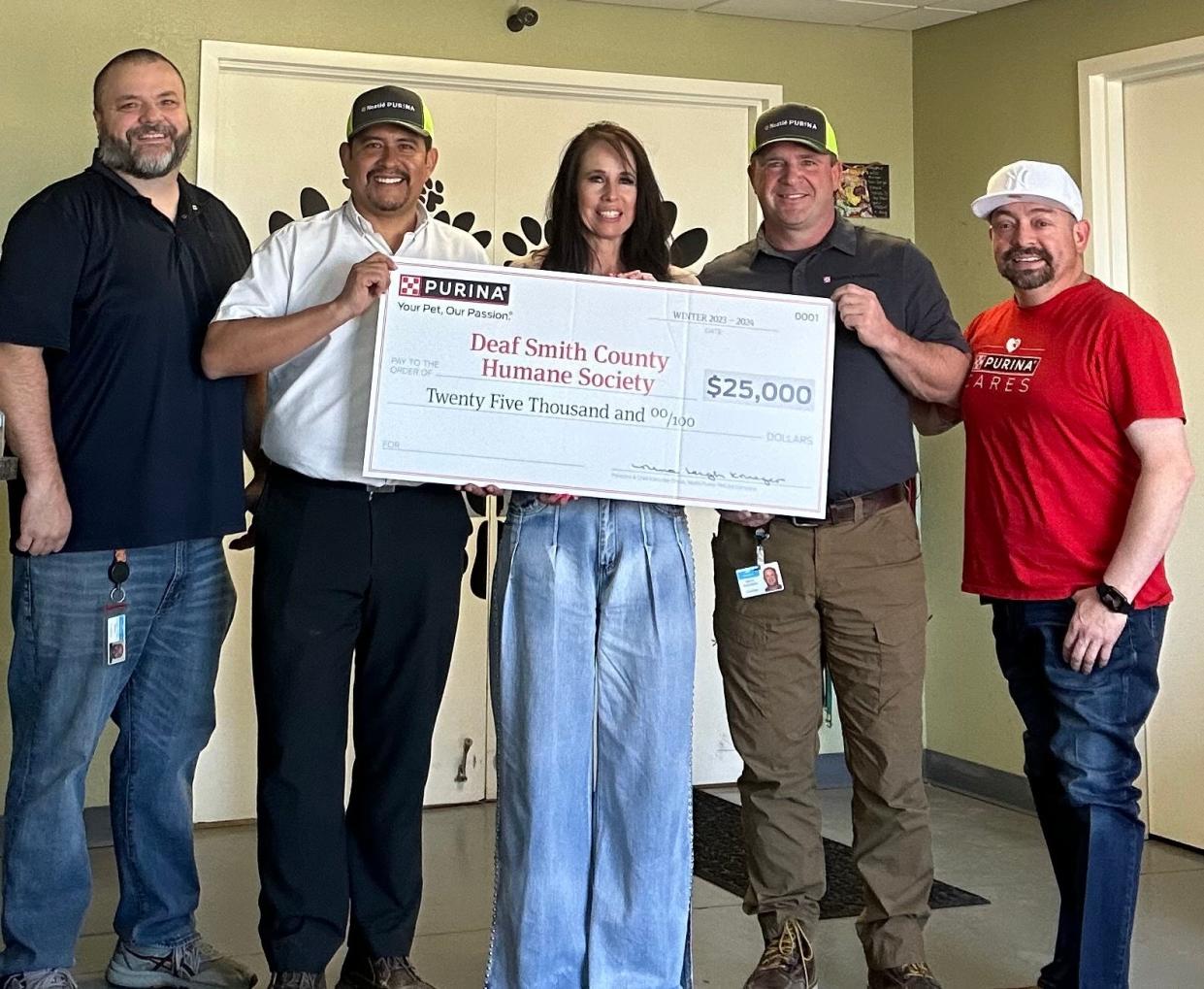 At the check presentation for Deaf Smith County, from left, Trent Webb, HR Manager, Purina; Hector Vallejo, Factory Manager, Purina; Kim Leonard, Director for Deaf Smith County Humane Society; Steven Hutchison, Assistant Factory Manager, Purina; and Gilbert Salinas Senior Manager of Production, Purina.