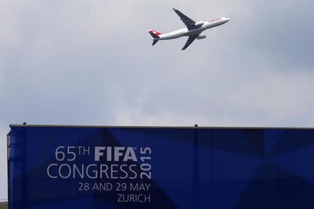 A Swiss airline aircraft takes off behind the Hallenstadion where the upcoming 65th FIFA Congress will take place in Zurich, Switzerland, May 27, 2015. REUTERS/Arnd Wiegmann