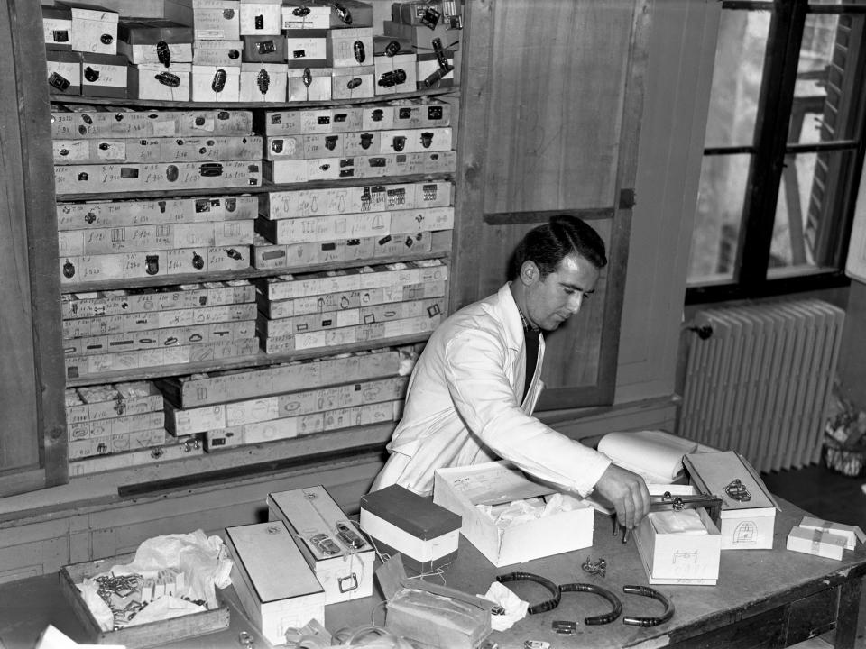 An artisan at work in the Gucci Workshop in the 1950s.