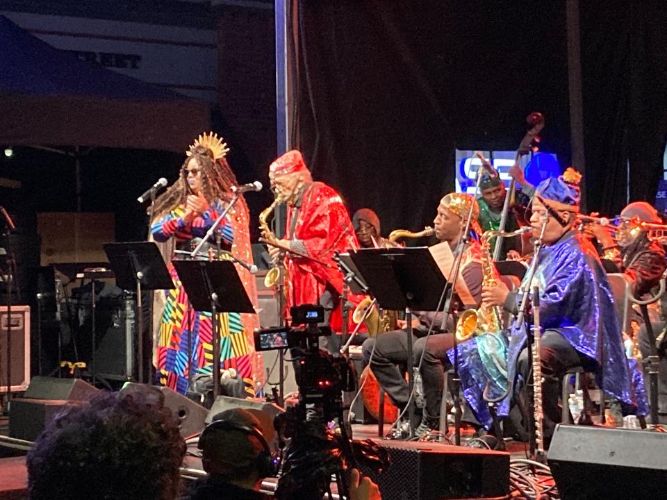 The Sun Ra Arkestra, directed by 99-year-old Marshall Allen (in red), performs June 8, 2023 on the Church Street Marketplace as part of the Burlington Discover Jazz Festival in Vermont.