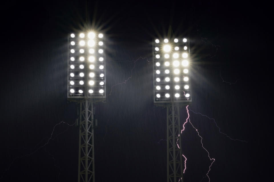 CINCINNATI, OHIO – JULY 17: Lightning strikes behind the stadiums lights during a weather delay of the game between the <a class="link " href="https://sports.yahoo.com/mlb/teams/san-francisco/" data-i13n="sec:content-canvas;subsec:anchor_text;elm:context_link" data-ylk="slk:San Francisco Giants;sec:content-canvas;subsec:anchor_text;elm:context_link;itc:0">San Francisco Giants</a> and the Cincinnati Reds at Great American Ball Park on July 17, 2023 in Cincinnati, Ohio. The game was suspended in the eighth inning tied 2-2. (Photo by Dylan Buell/Getty Images)