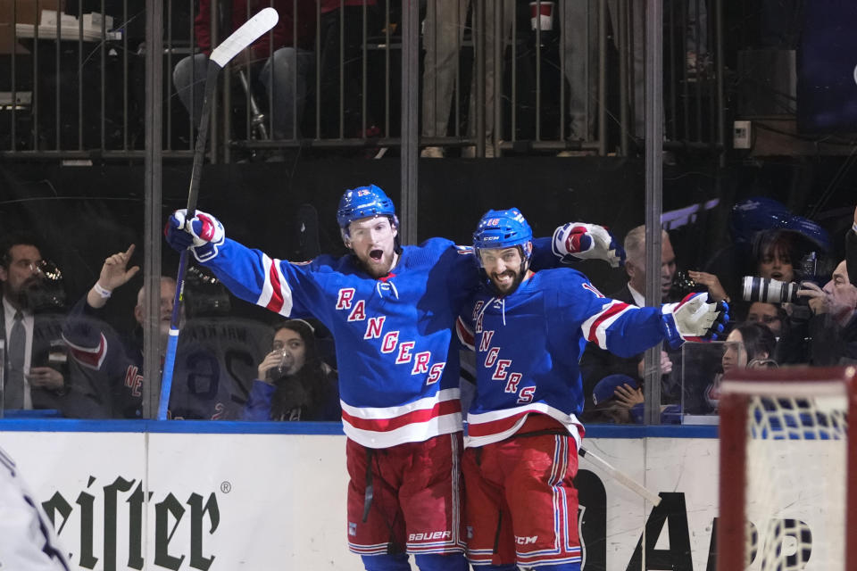 New York Rangers' Alexis Lafreniere, left, celebrates with Vincent Trocheck after Trochek scored his second goal of an NHL hockey game, during the second period, against the Los Angeles Kings Sunday, Feb. 26, 2023, in New York. (AP Photo/Frank Franklin II)