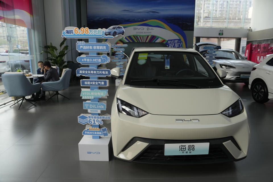 The Seagull electric vehicle from Chinese automaker BYD is displayed at a showroom in Beijing, Wednesday, April 10, 2024. The tiny, low-priced electric vehicle called the Seagull has American automakers and politicians trembling. The car, launched last year by Chinese automaker BYD, sells for around $12,000 in China. But it drives well and is put together with craftsmanship that rivals U.S.-made electric vehicles that cost three times as much. Tariffs on imported Chinese vehicles probably will keep the Seagull away from America’s shores for now.(AP Photo/Ng Han Guan)